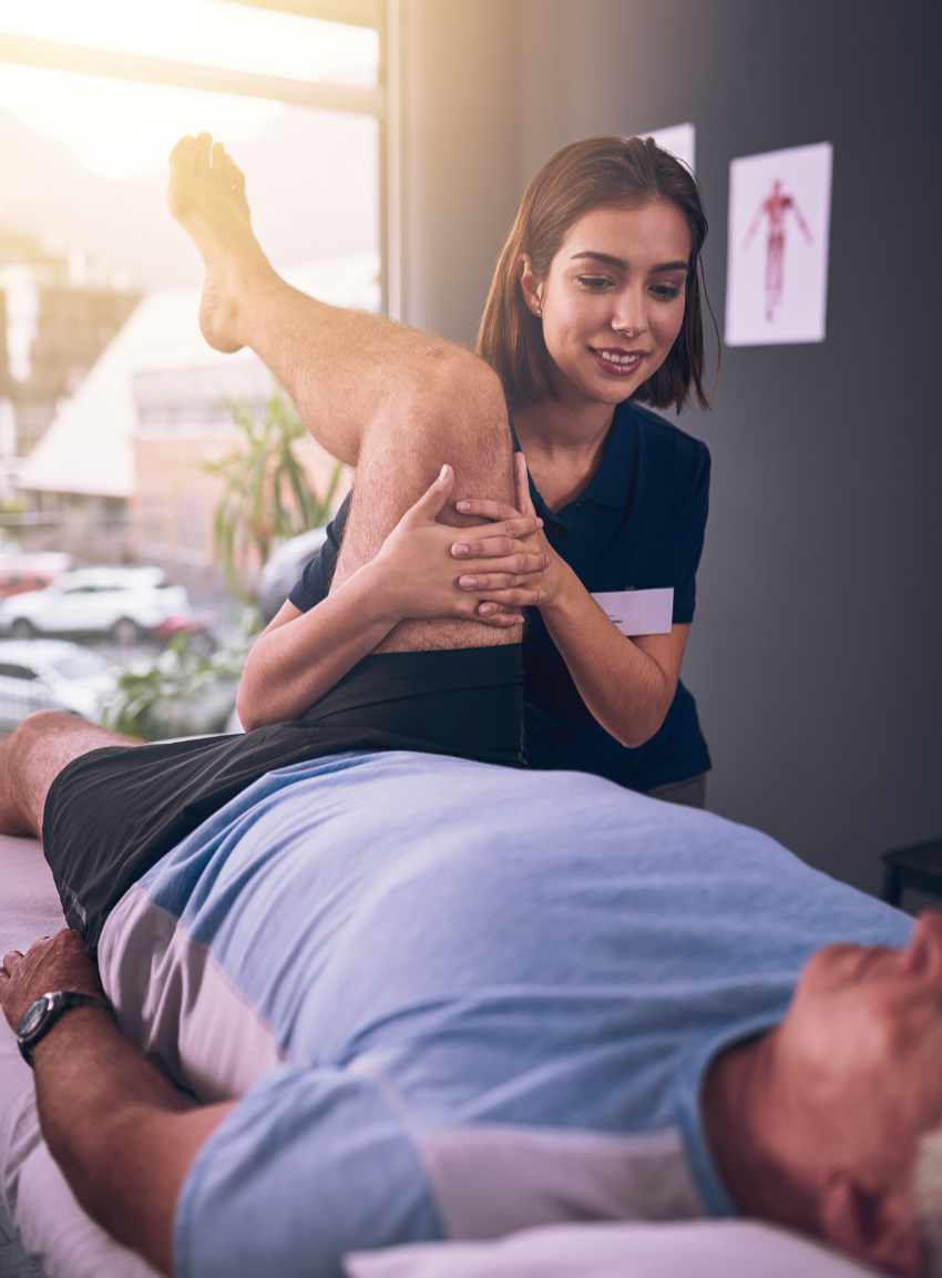 Physiotherapist supporting a patient